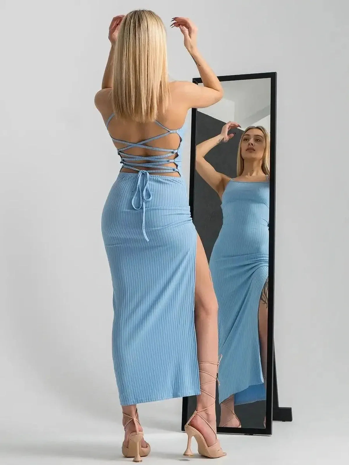 Sky Lace Midi Dress in blue, featuring open corset back and flattering bodycon fit with high side slit.