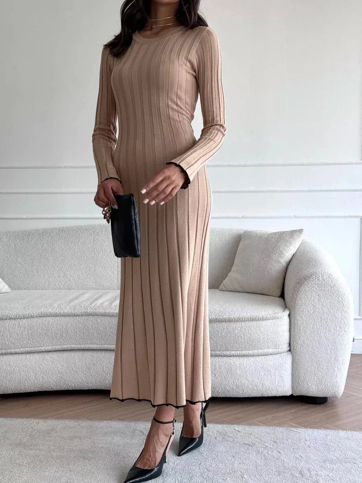 Sahara Curve Maxi Dress in Sandstone Beige, featuring a ribbed knit and elegant full-length silhouette.