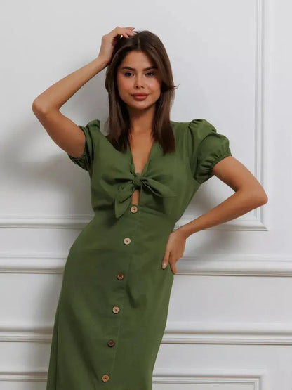 Olive Whisper Maxi Dress featuring puff sleeves and a tie-front, perfect for summer and wedding guest occasions.