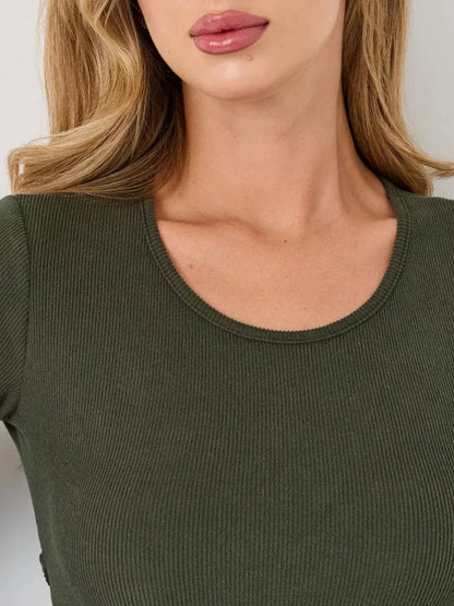 Close-up of a woman's neckline in a ribbed, olive green mini dress, showcasing comfort and style for summer dresses.