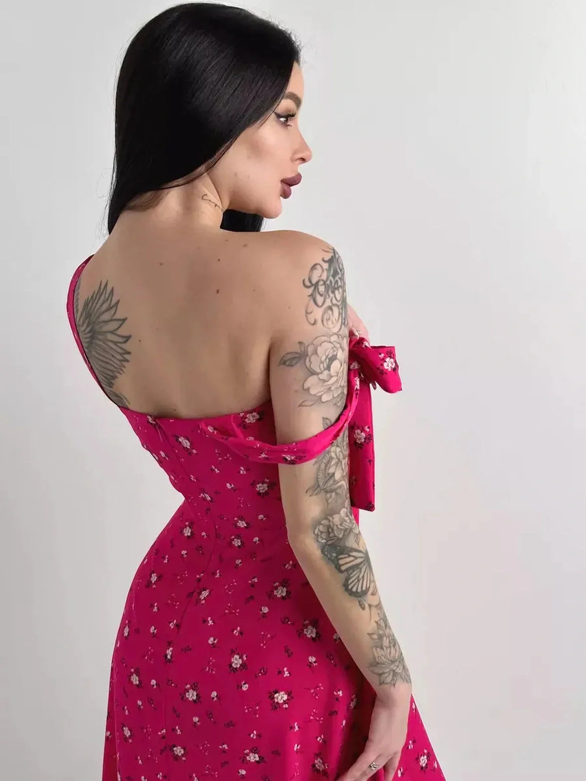 Rosé Charm Midi Dress in vibrant pink floral print featuring adjustable shoulder ties and flattering silhouette.