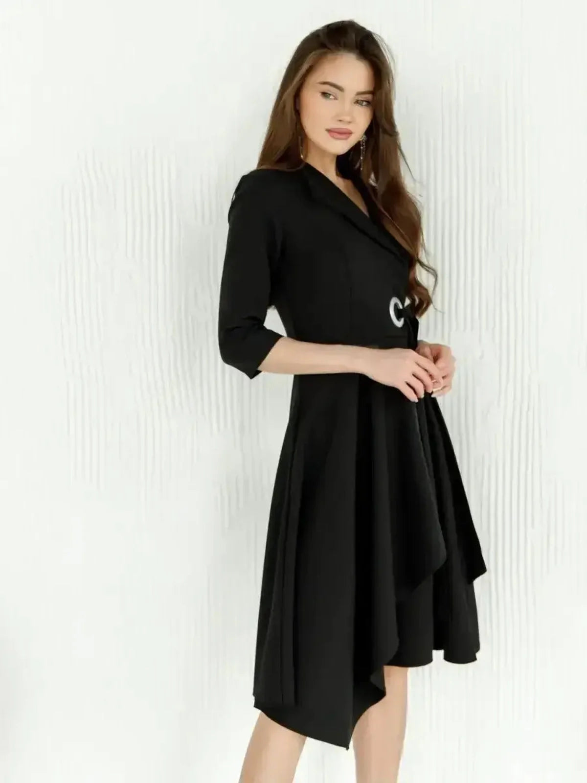 Elegant black midi dress with an asymmetric hem and tailored wrap silhouette, ideal for weddings and special occasions.