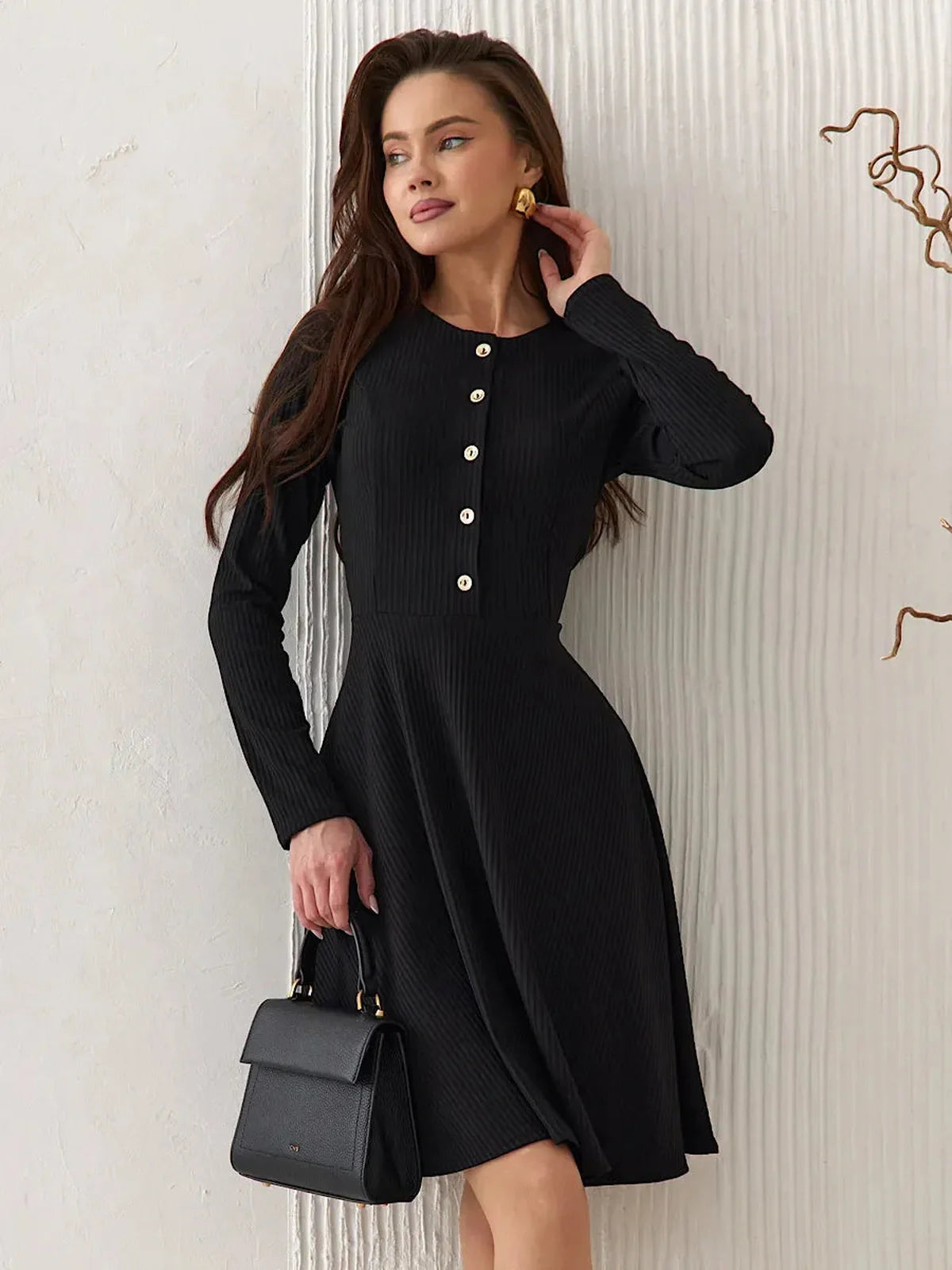 Elegant Mod Noir black mini dress with long sleeves and button details, ideal for summer cocktail and wedding guest occasions.