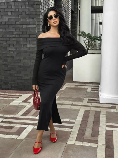 Elegant off-shoulder black maxi dress with flattering slit, perfect for summer events and evening occasions.