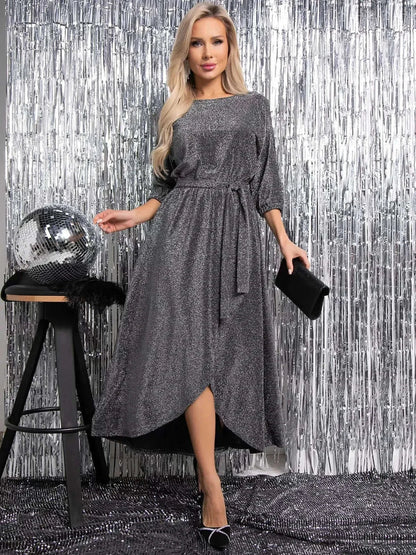 Elegant woman in shimmering Luna Shine Midi Dress with side slit, perfect for weddings, cocktail events, and evening glamour.