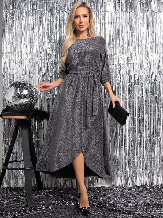 Elegant woman in shimmering Luna Shine Midi Dress with side slit, perfect for weddings, cocktail events, and evening glamour.