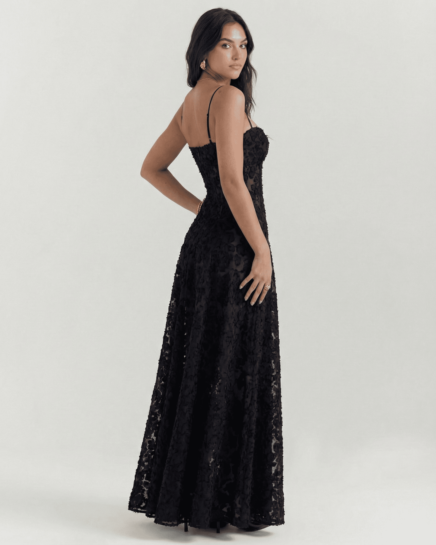 Nerina Maxi Dress by Slimona in black floral lace, showcasing the elegant sheer back detail and fitted bodice.