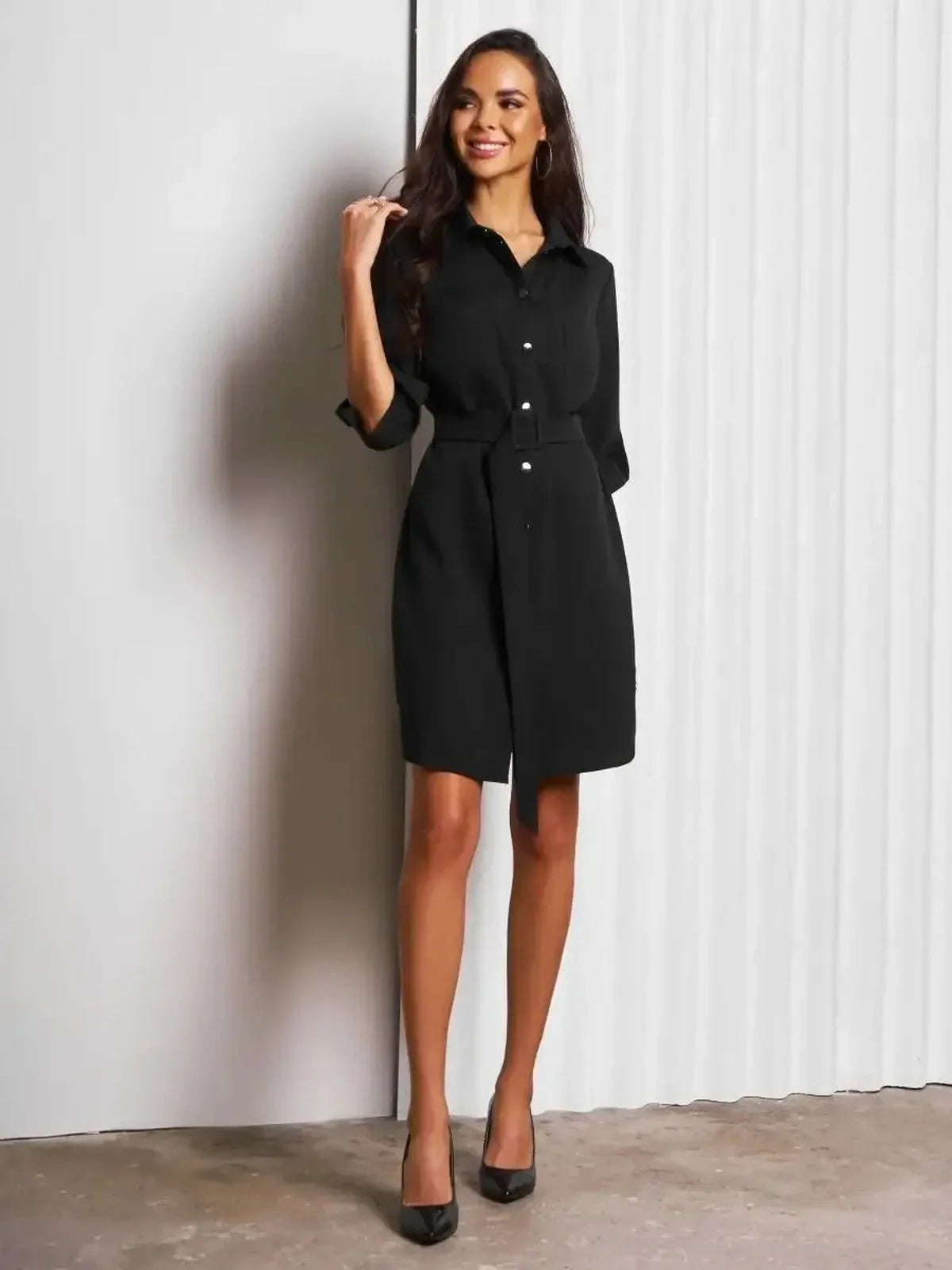Urban Edit Mini black mini dress with a structured silhouette and detachable belt, ideal for versatile styling.