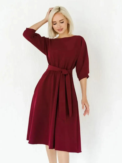 Crimson Grace Midi Dress in burgundy with flowing A-line skirt and self-tie belt, perfect for weddings and formal events.