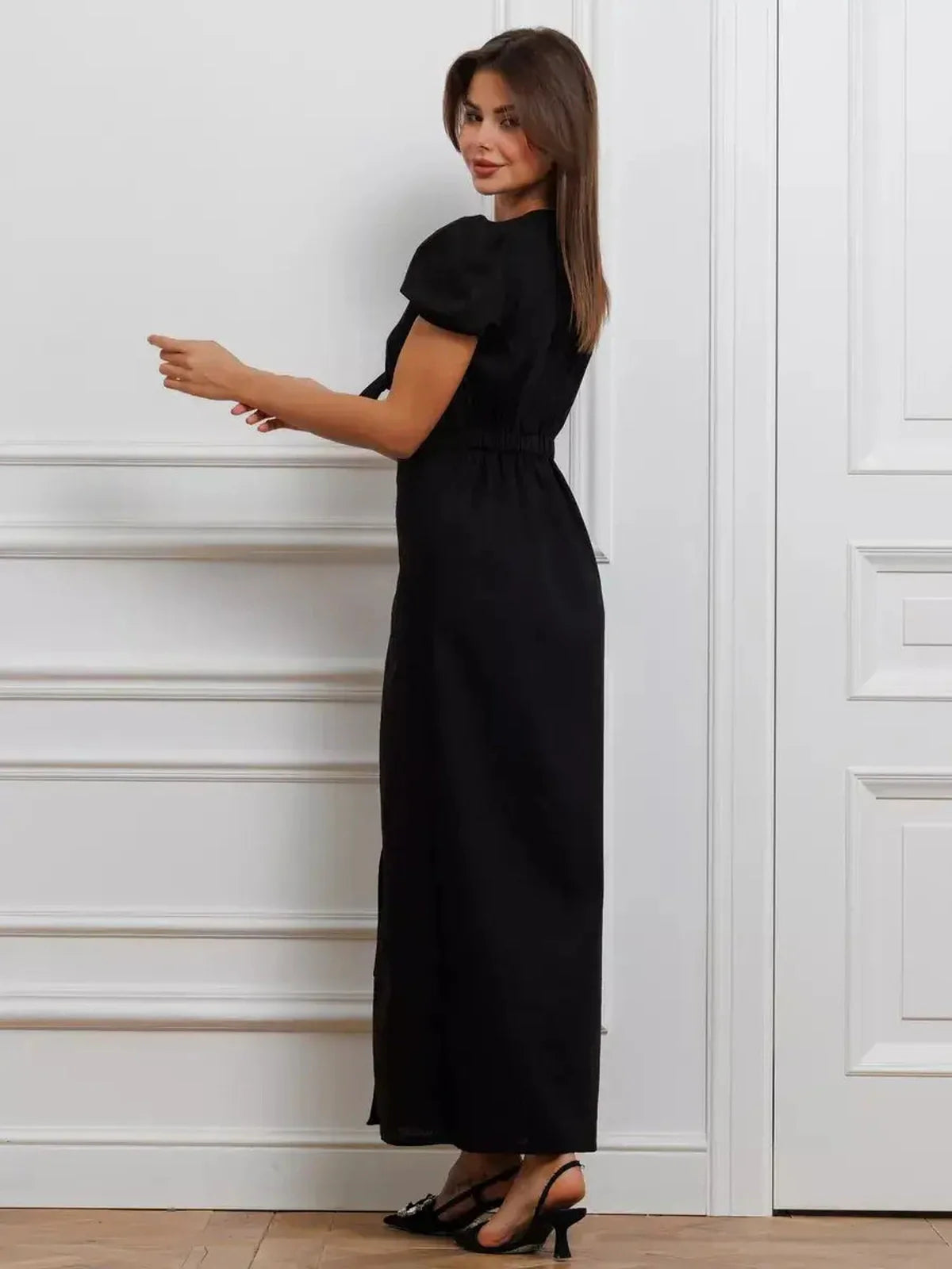 Elegant black maxi dress with tie-front detail, perfect for weddings, prom, or formal occasions. Flattering silhouette for women.