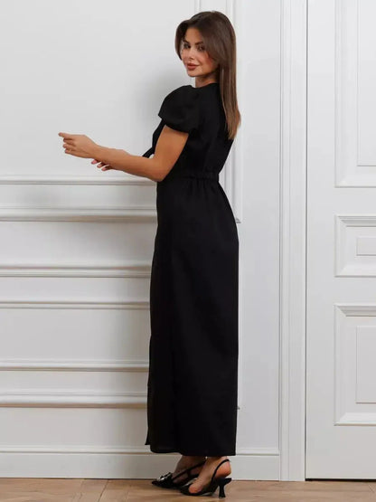 Elegant black maxi dress with tie-front detail, perfect for weddings, prom, or formal occasions. Flattering silhouette for women.
