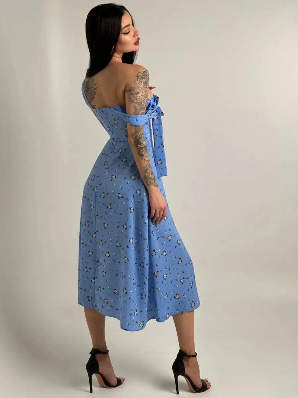 Floral Charm Midi Dress in blue with shoulder bows and floral print, perfect for summer weddings and special occasions.
