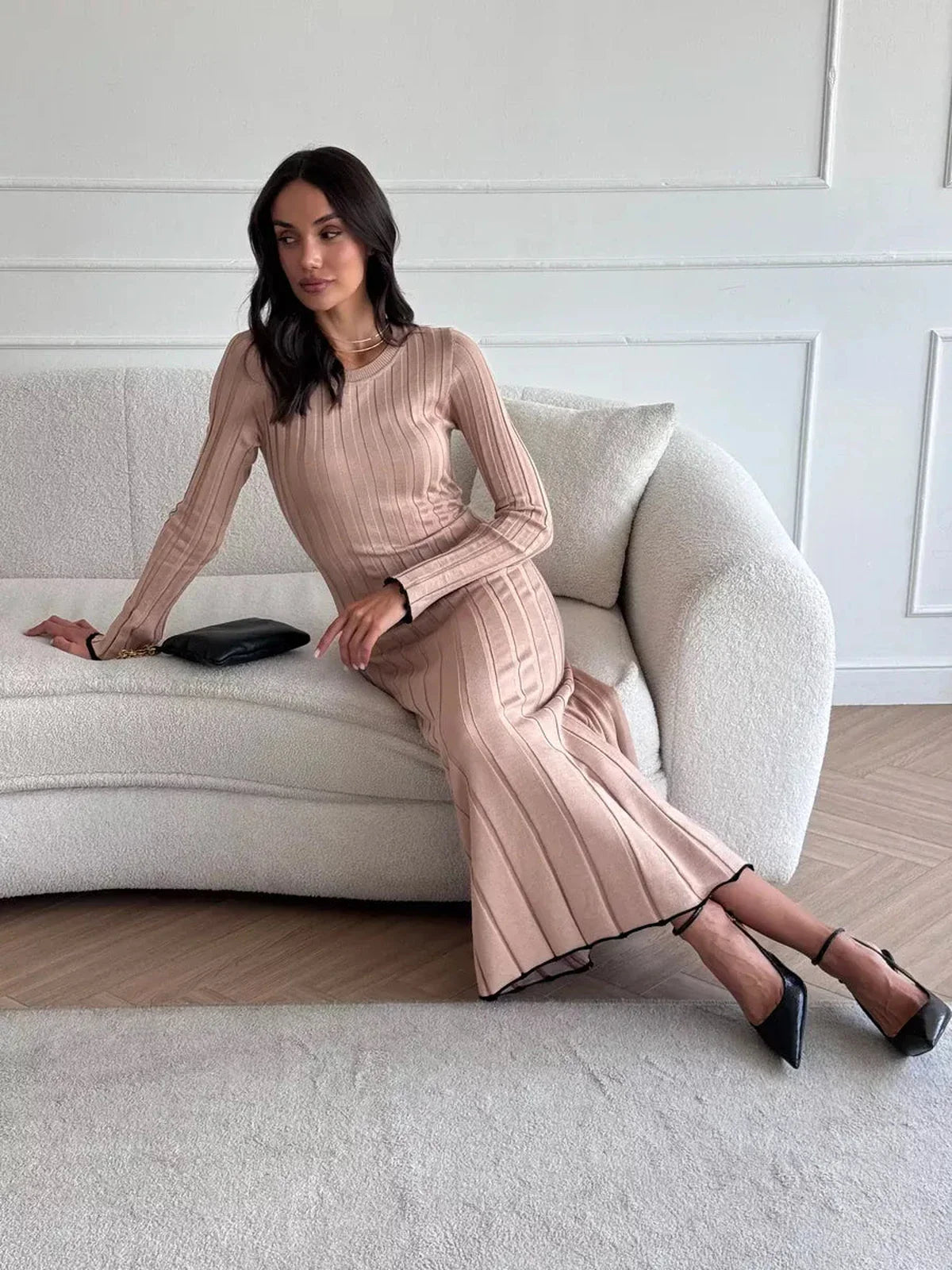 Sahara Curve Maxi Dress in sandstone beige on model, exuding elegance with soft ribbed texture and full-length cut.