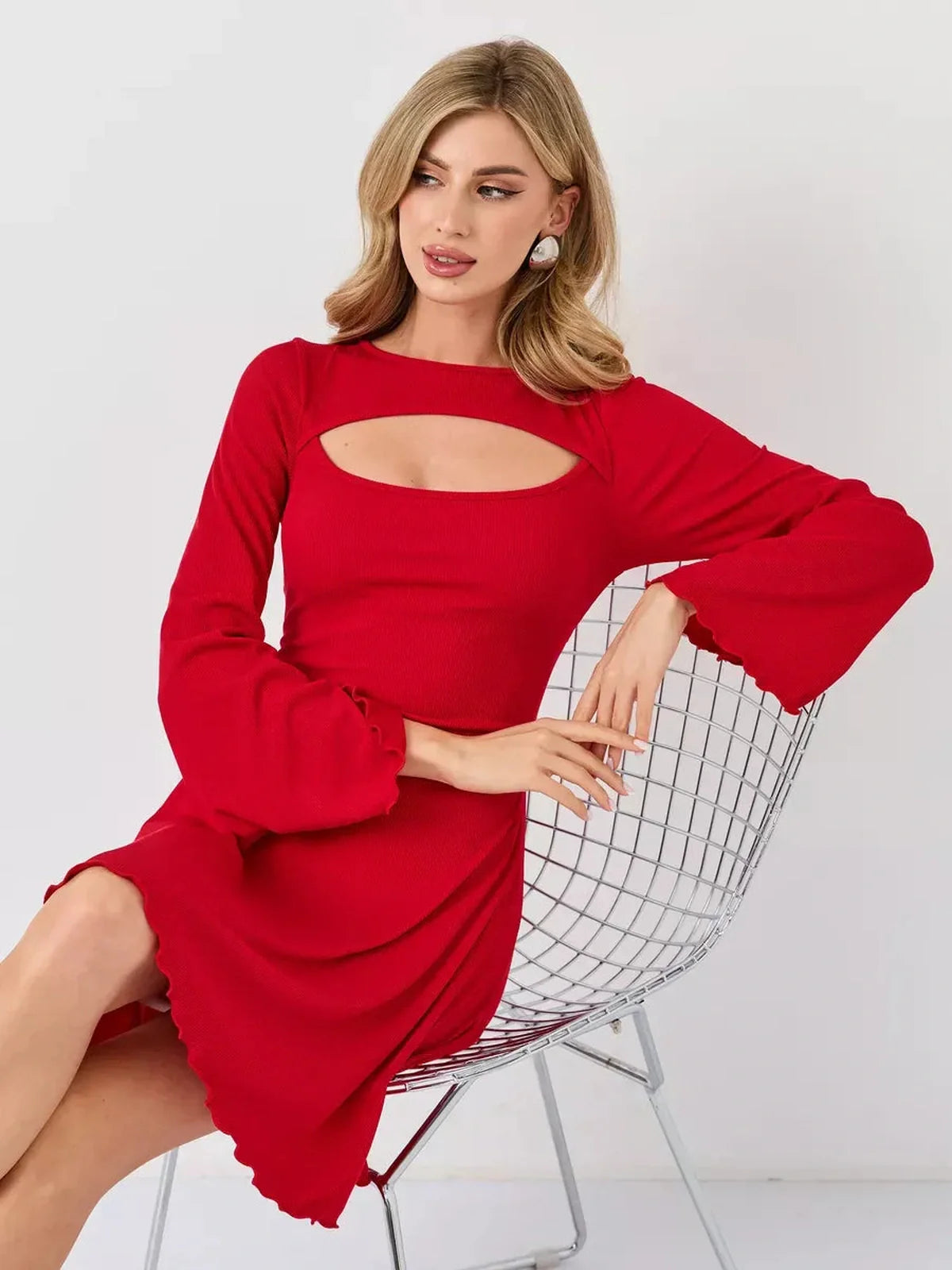 Stylish woman in a red flare cutout mini dress, showcasing modern elegance, perfect for weddings and formal events.
