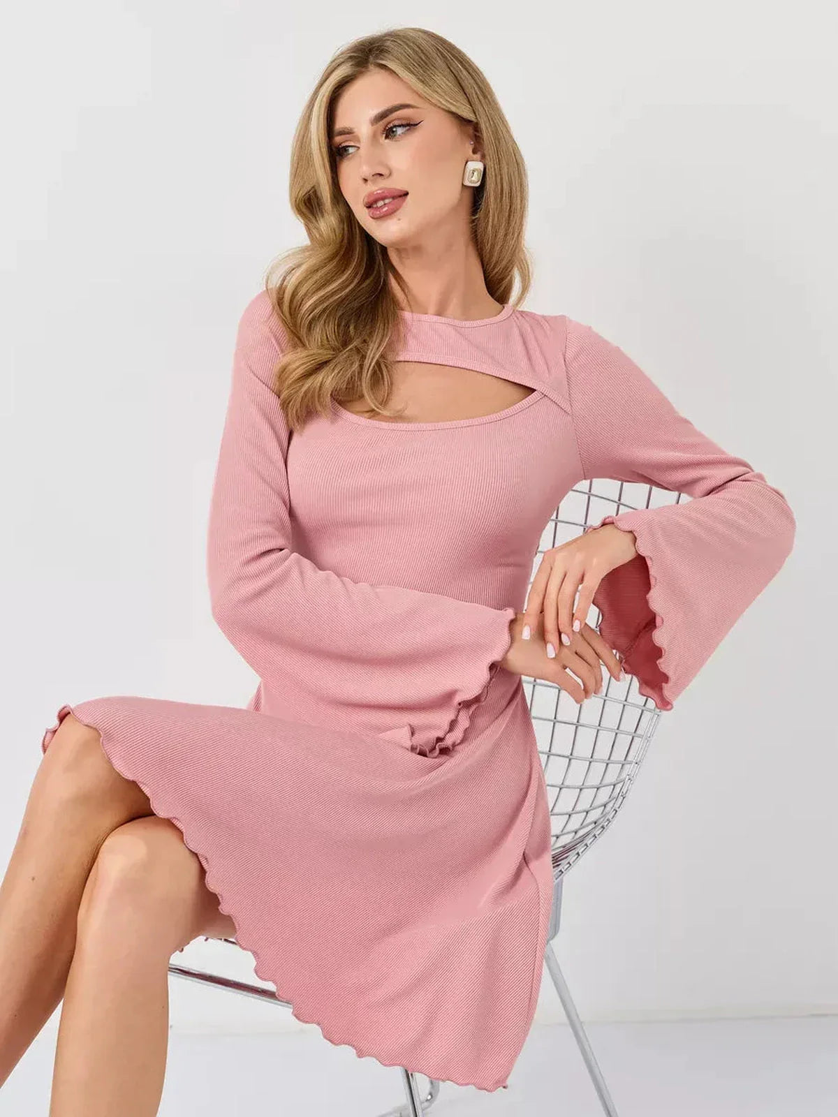 Model in a pink Blush Whisper summer dress with bell sleeves, perfect for weddings and formal occasions.