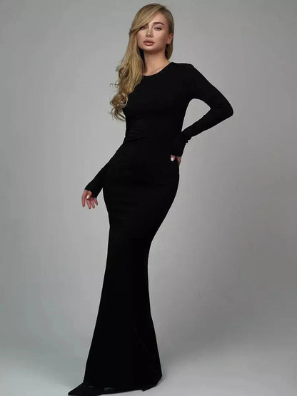Model showcasing the Sculpted Elegance Maxi Dress in black, a seamless and breathable formal dress.