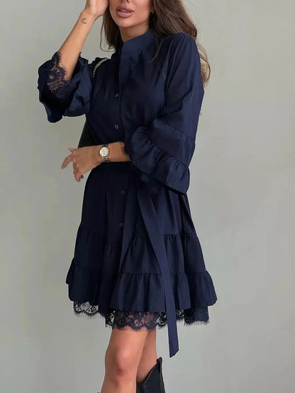 Navy blue lace flare mini dress featuring oversized silhouette and tiered ruffles, ideal for summer and special occasions.