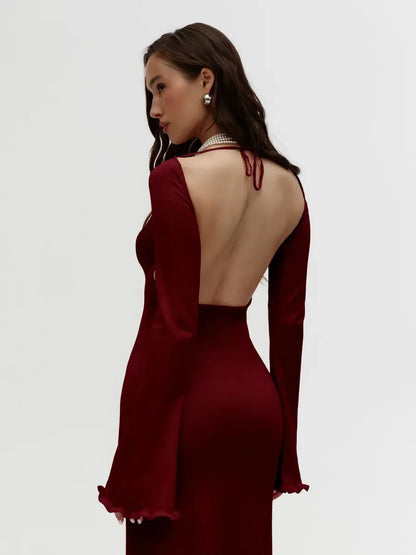Elegant ruffle-back midi dress in burgundy with open back and long sleeves, perfect for weddings or formal occasions.