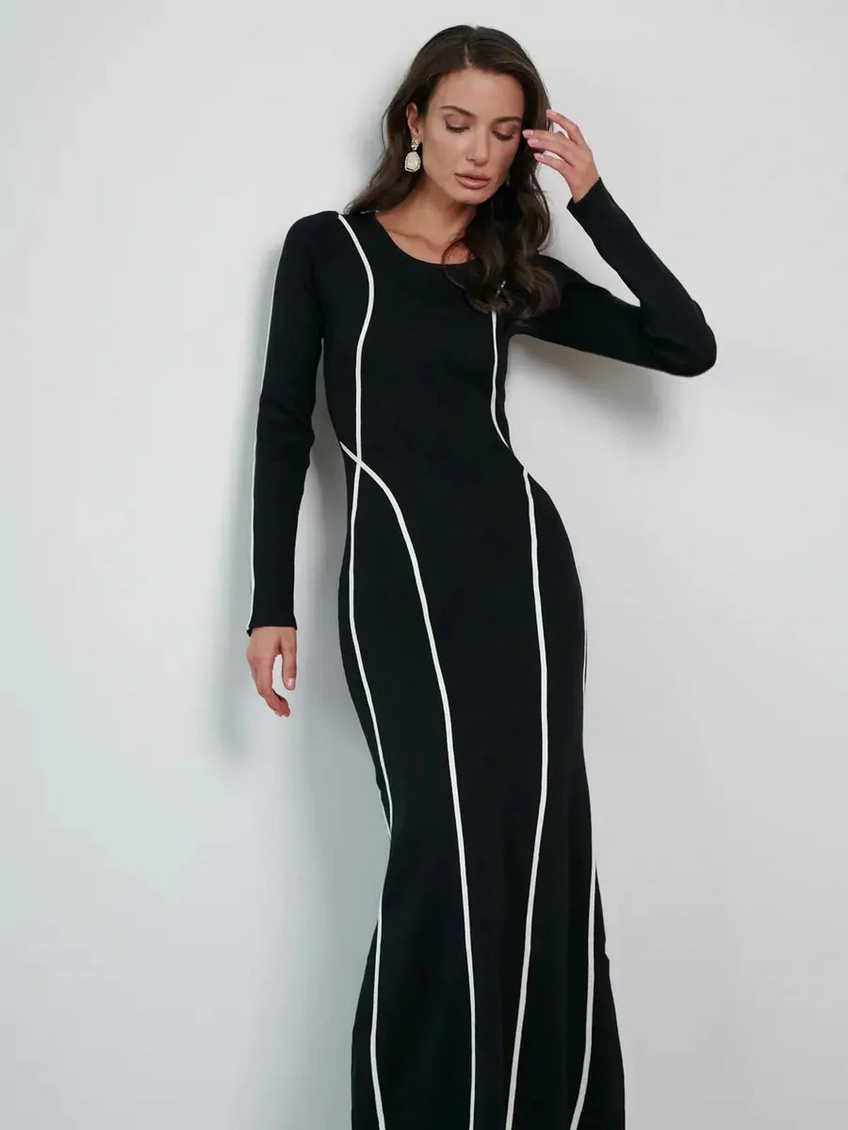 Elegant black maxi dress with white contrast piping, perfect for formal events and special occasions.