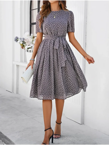 Serene Charm Midi Dress in gray with polka dots, perfect for summer, weddings, or semi-formal occasions.