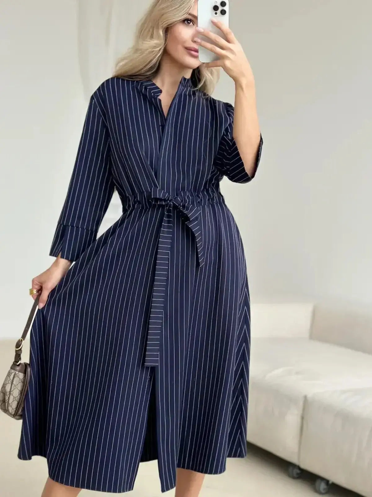 Elegant pinstripe midi dress with self-tie waist, perfect for summer weddings and formal events.