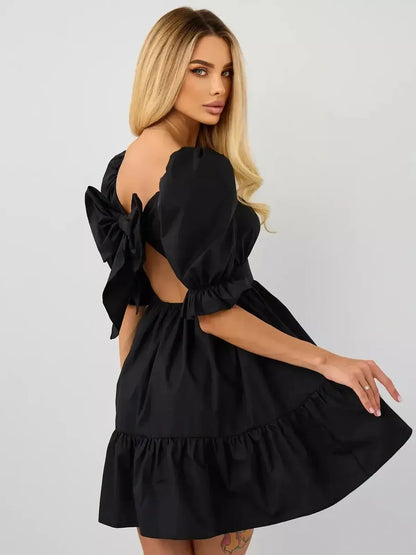 Elegant black mini dress with puff sleeves and back bow detail, perfect for summer events and special occasions.
