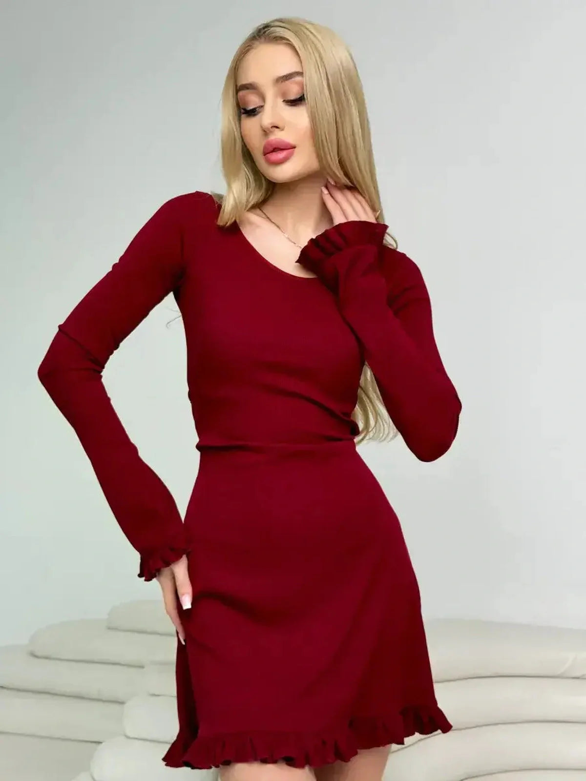 Model showcasing the Crimson Flare red mini dress with romantic ruffles, perfect for weddings and special occasions.