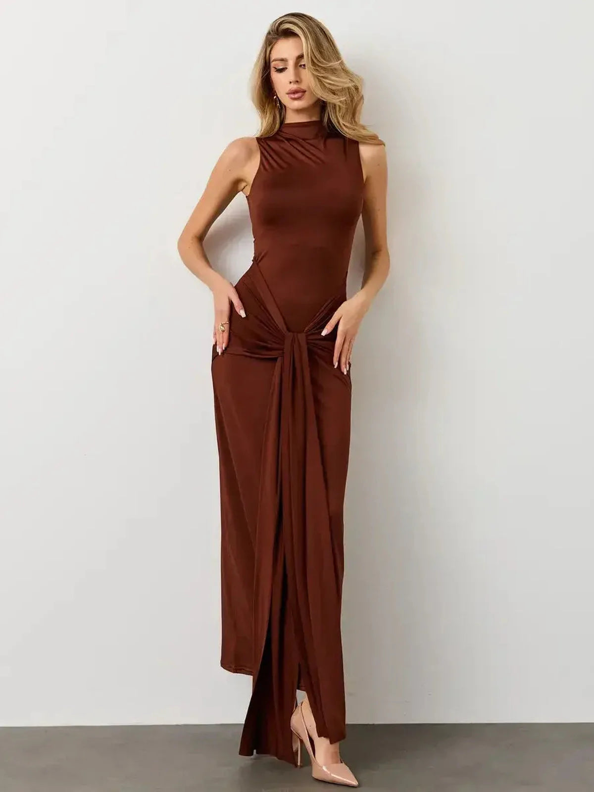 Mocha Muse Maxi Dress featuring a sleek high neckline and draped front knot, embodying elegance and confidence.