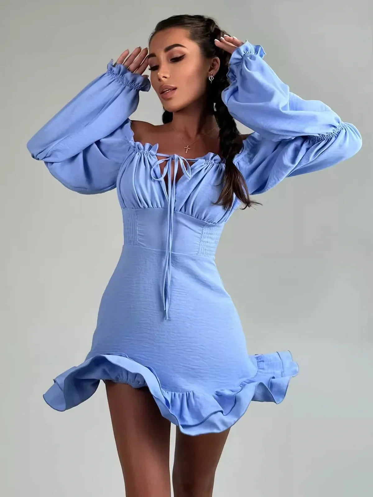 Sky-blue boho frill mini dress with off-shoulder neckline and romantic ruffle details, perfect for summer weddings or parties.