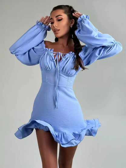 Sky-blue boho frill mini dress with off-shoulder neckline and romantic ruffle details, perfect for summer weddings or parties.
