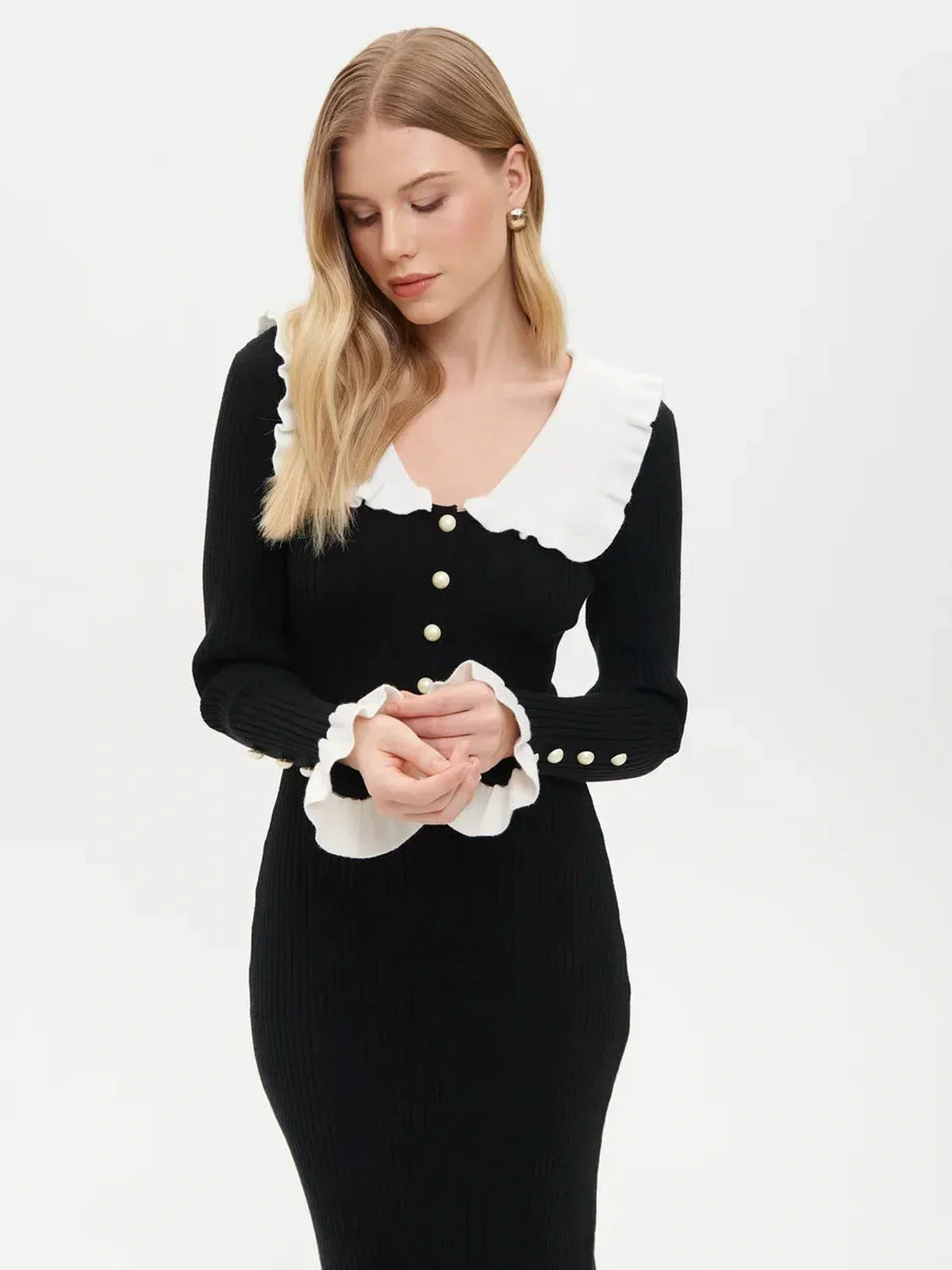 Elegant black midi dress with ruffle collar and white cuffs, perfect for weddings and formal occasions.