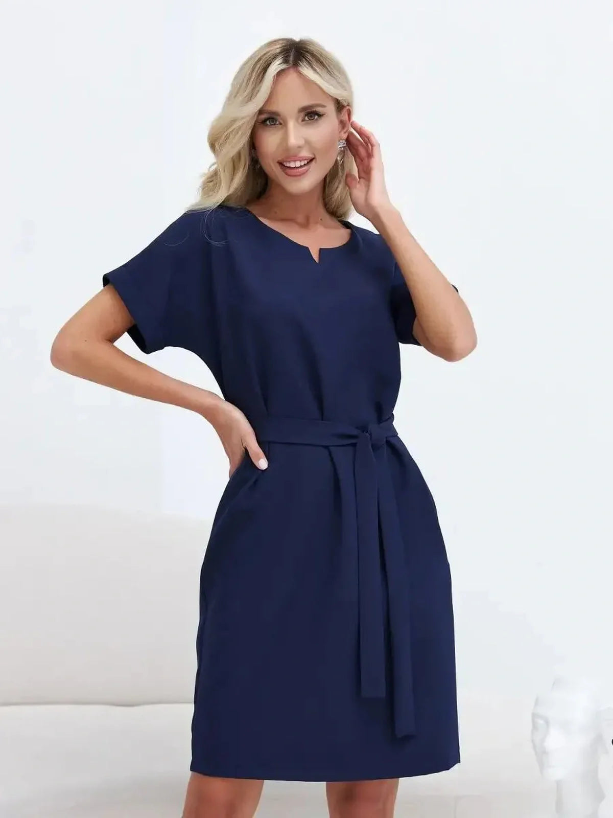 Navy Line mini dress featuring a relaxed sheath cut and included belt, ideal for work or casual events.