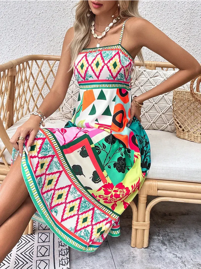 Vibrant Tropica Muse Midi Dress featuring bold patterns, perfect for summer outings or garden parties.