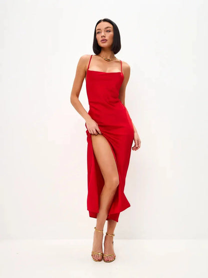 Scarlet Glow Midi Dress featuring a strappy silhouette and daring side slit, perfect for weddings or formal events.
