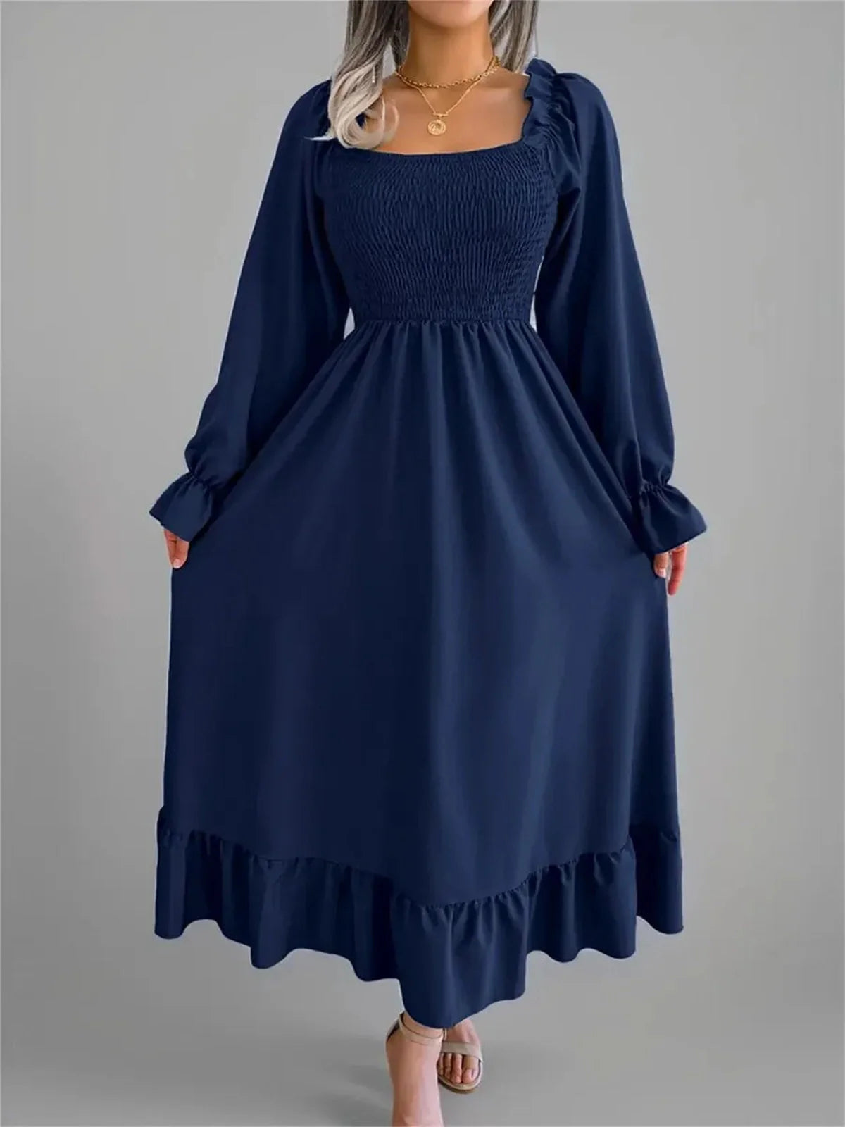 Midnight Charm Midi Dress in navy blue, featuring a smocked bodice and flounce hem, perfect for summer weddings or casual outings.