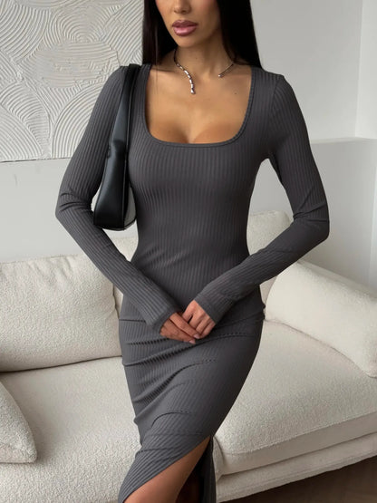 Sculpted Grace Midi Dress in sleek ribbed fabric with a thigh-high slit, perfect for weddings and formal occasions.