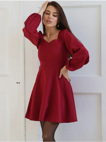 Ruby Flare red mini dress with sweetheart neckline and puff sleeves, perfect for weddings, proms, or special occasions.