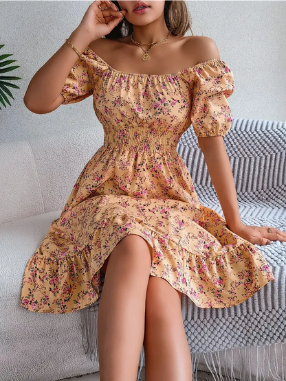 Floral midi dress with smocked waist and puff sleeves, perfect for summer occasions and festive events.