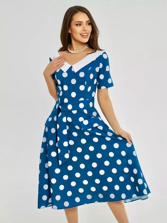 Pearl Dot Midi Dress in dark teal with white polka dots, featuring a white collar and tie waist. Perfect for summer events.