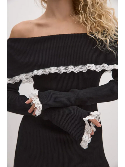 Black lace off-shoulder mini dress featuring ribbed knit and elegant white lace trims, perfect for summer weddings or formal events.