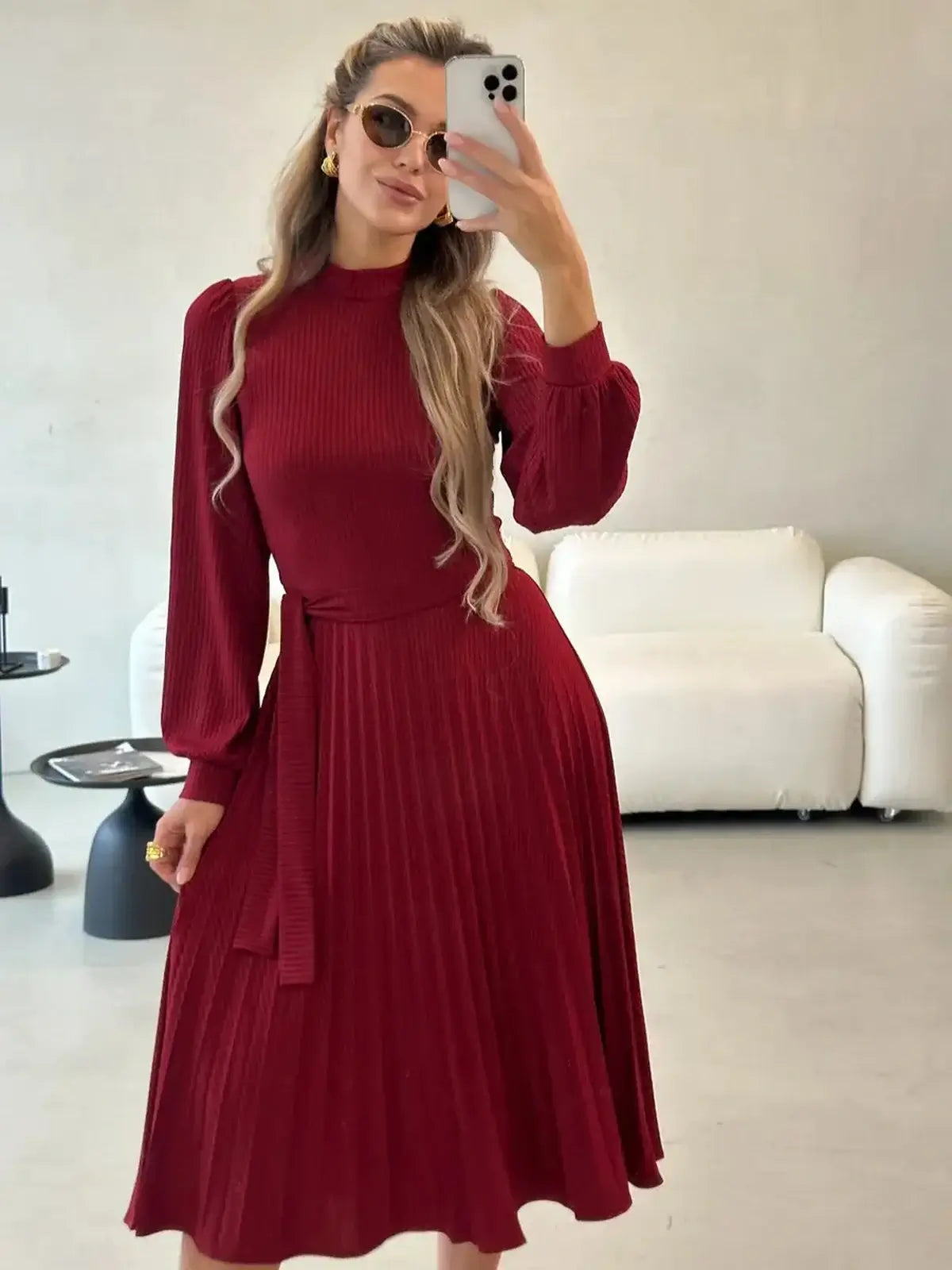 Crimson Grace Midi Dress in red with pleats, perfect for weddings or formal occasions, showcasing timeless elegance and comfort.