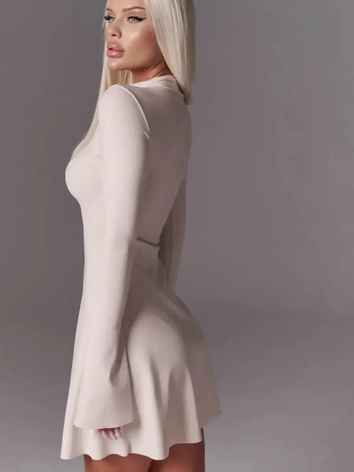 Ivory flare mini dress with bell sleeves, showcasing sleek minimalism and a sculpted fit, perfect for weddings or parties.