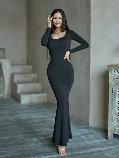 Long sleeve Sculpted Noir Maxi Dress in black, showcasing a sleek silhouette fit for weddings and formal events.