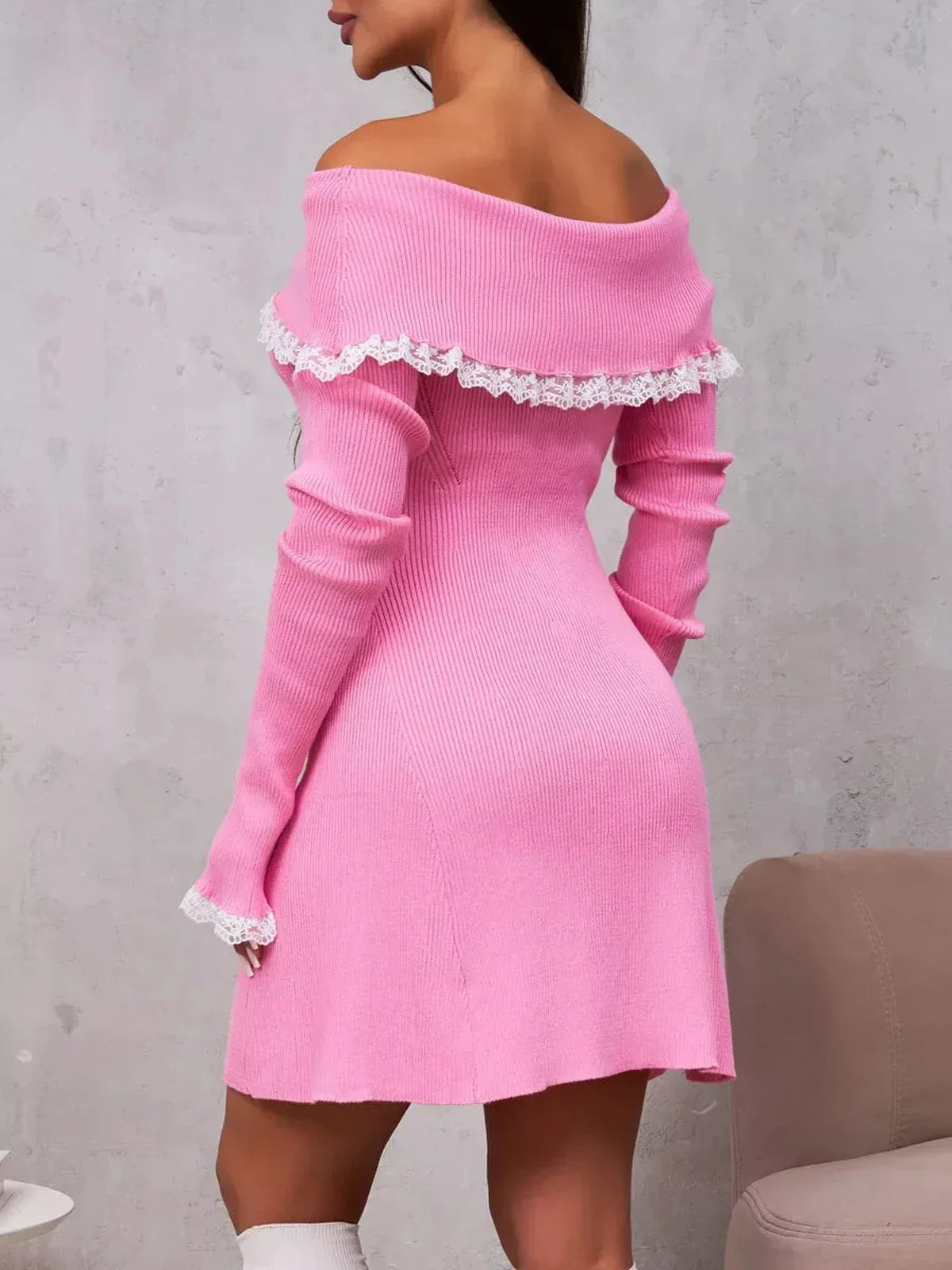 Off-shoulder pink mini dress with lace trim, showcasing a feminine silhouette and elegant style.
