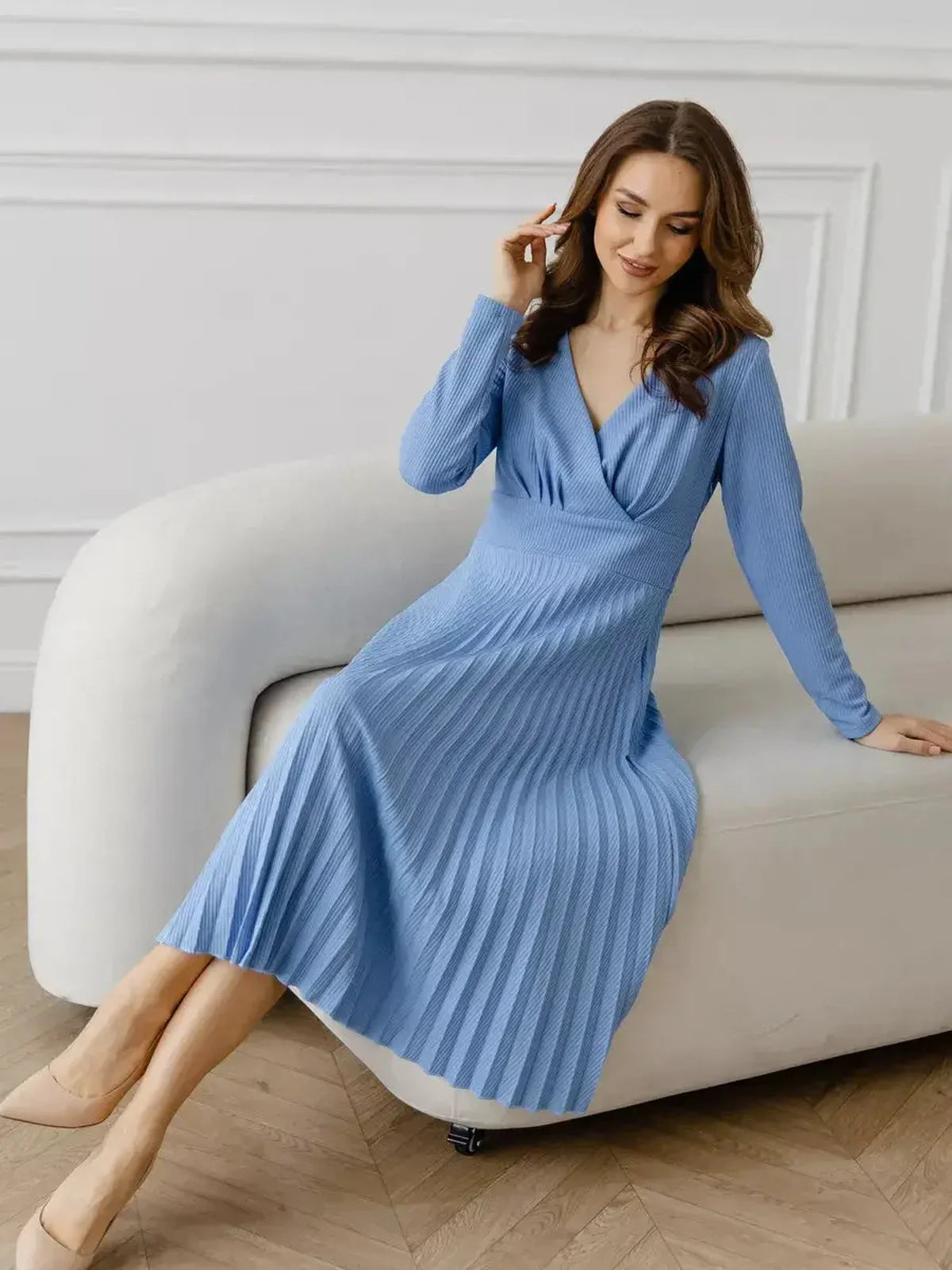 Celeste Midi Dress in serene sky blue, showcasing elegant pleats and a V-neckline, perfect for summer occasions and weddings.