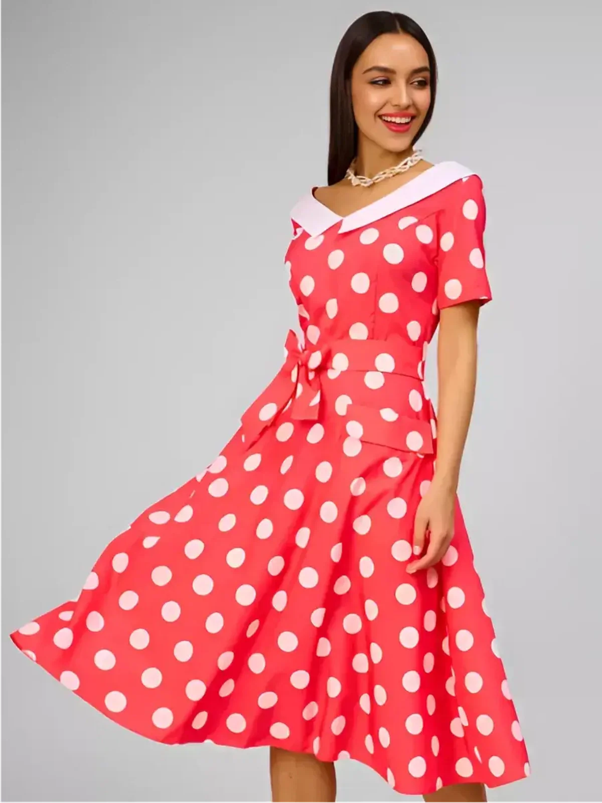 Sailor Chic Midi Dress featuring vibrant pink polka dots, a structured sailor collar, and a flattering fit-and-flare silhouette.