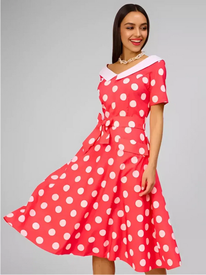 Sailor Chic Midi Dress featuring vibrant pink polka dots, a structured sailor collar, and a flattering fit-and-flare silhouette.