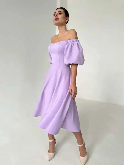 Lilac Grace Midi Dress with off-shoulder puff sleeves, perfect for weddings, summer parties, and elegant occasions.