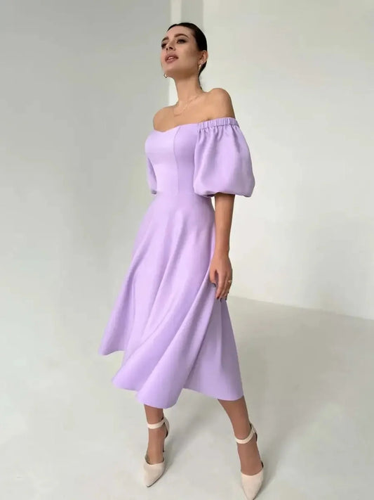 Lilac Grace Midi Dress with off-shoulder puff sleeves, perfect for weddings, summer parties, and elegant occasions.