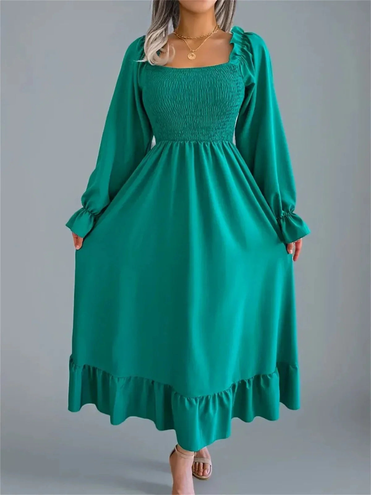 Meadow Ruffle Midi Dress in rich green with long sleeves, smocked bodice, and flowing skirt, perfect for weddings or casual wear.